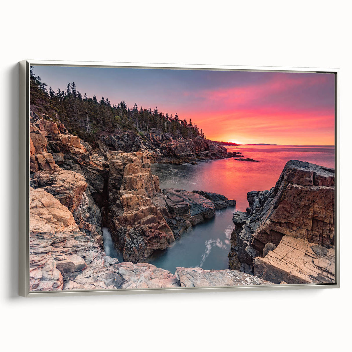 Framed canvas of Acadia landscape with colorful foliage and silver frame, ideal for enhancing a living room's ambiance.
