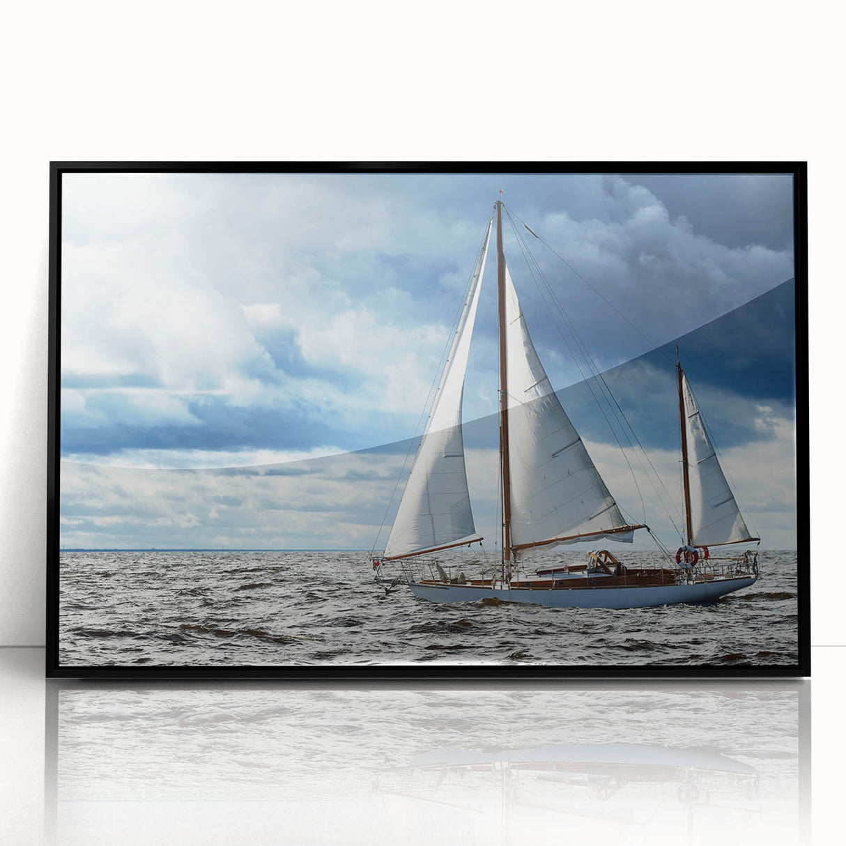 Large abstract wall art depicting a serene Maine landscape in muted blue and green tones, framed in black acrylic.