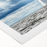 Art deco poster of a Maine coastline in muted blue tones on rolled canvas, suitable for dining room decor.