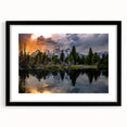 Abstract art print of the Grand Tetons in vibrant colors on a large framed canvas, suitable for living room decor.