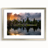 Textured art print of the Grand Tetons in muted earth tones on a silver-framed mat, ideal for bedroom decor.