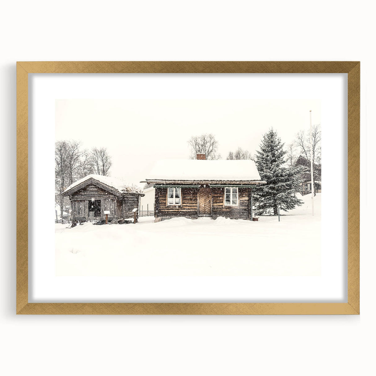 Abstract art print depicting a winter scene in muted blue and white tones, framed in gold, ideal for dining room decor.