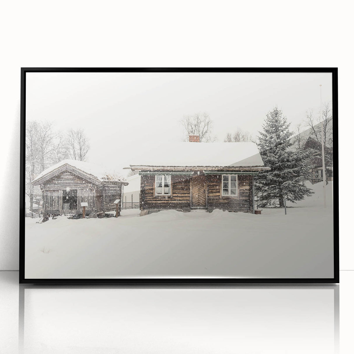 Large abstract wall art depicting winter scene in muted blue and white tones, framed in black acrylic.