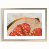 Textured art print of abstract fruits in vibrant red and orange hues, framed in silver, ideal for bedroom wall decor.