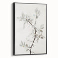 Framed canvas art showcasing an abstract floral design in vibrant colors with a sleek black frame, viewed from the side, perfect for modern decor.