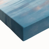 Close-up of a vibrant abstract landscape stretched canvas, showcasing rich blues and greens that evoke a serene natural scene, perfect for modern home decor.