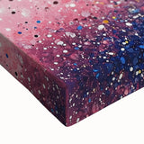 Close-up of a vibrant abstract floral stretched canvas artwork showcasing intricate details in bold colors like pink, green, and blue, perfect for modern decor.