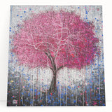 Stretched canvas artwork depicting vibrant abstract floral designs in bold colors, leaning against a light-colored wall, ideal for modern home decor and art enthusiasts.