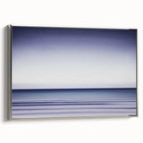 Framed canvas artwork showcasing an abstract landscape in soothing silver tones, highlighting elegant curves and textures, ideal for contemporary home decor.