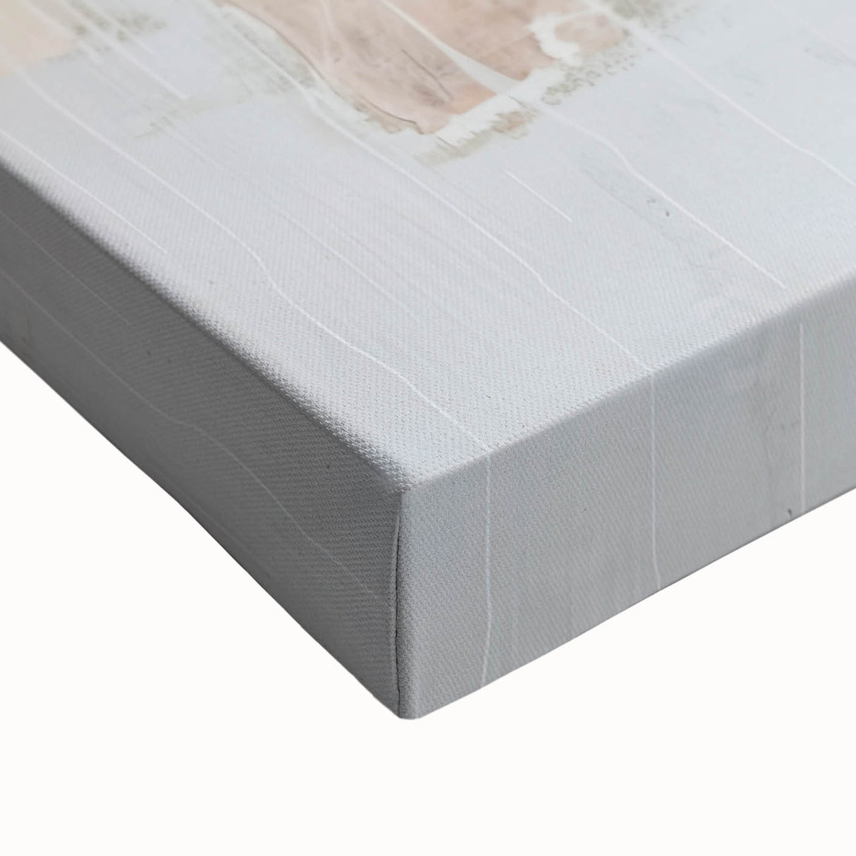 Close-up of an abstract minimalist wall art design on stretched canvas, featuring soft pastel colors and geometric shapes, perfect for modern decor.