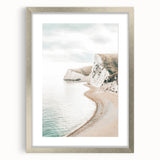 Textured abstract art print in warm yellow and orange tones on a silver-framed canvas, suitable for bedroom decor.