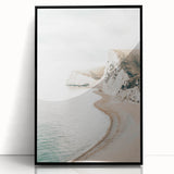 Large abstract wall art featuring swirling patterns in warm orange and yellow tones, framed in black acrylic.