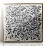 Framed acrylic artwork showcasing an abstract design with vibrant gold splatters on a sleek black background, ideal for modern home decor and art enthusiasts.