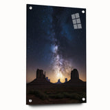 Acrylic landscape art depicting a serene desert scene with vibrant colors, showcased from a side view and secured with pins for display stability.