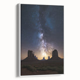 Framed canvas artwork depicting a serene desert landscape with warm colors and textured details, presented in a sleek white frame for a modern aesthetic. Perfect for enhancing home decor.