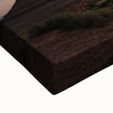 Close-up of a stretched canvas showcasing a vibrant desert landscape art piece, highlighting warm tones of orange and brown with intricate details, perfect for home decor.