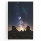 Stretched canvas artwork depicting a serene desert landscape at sunset, featuring warm orange and yellow hues, perfect for home decor or office ambiance.