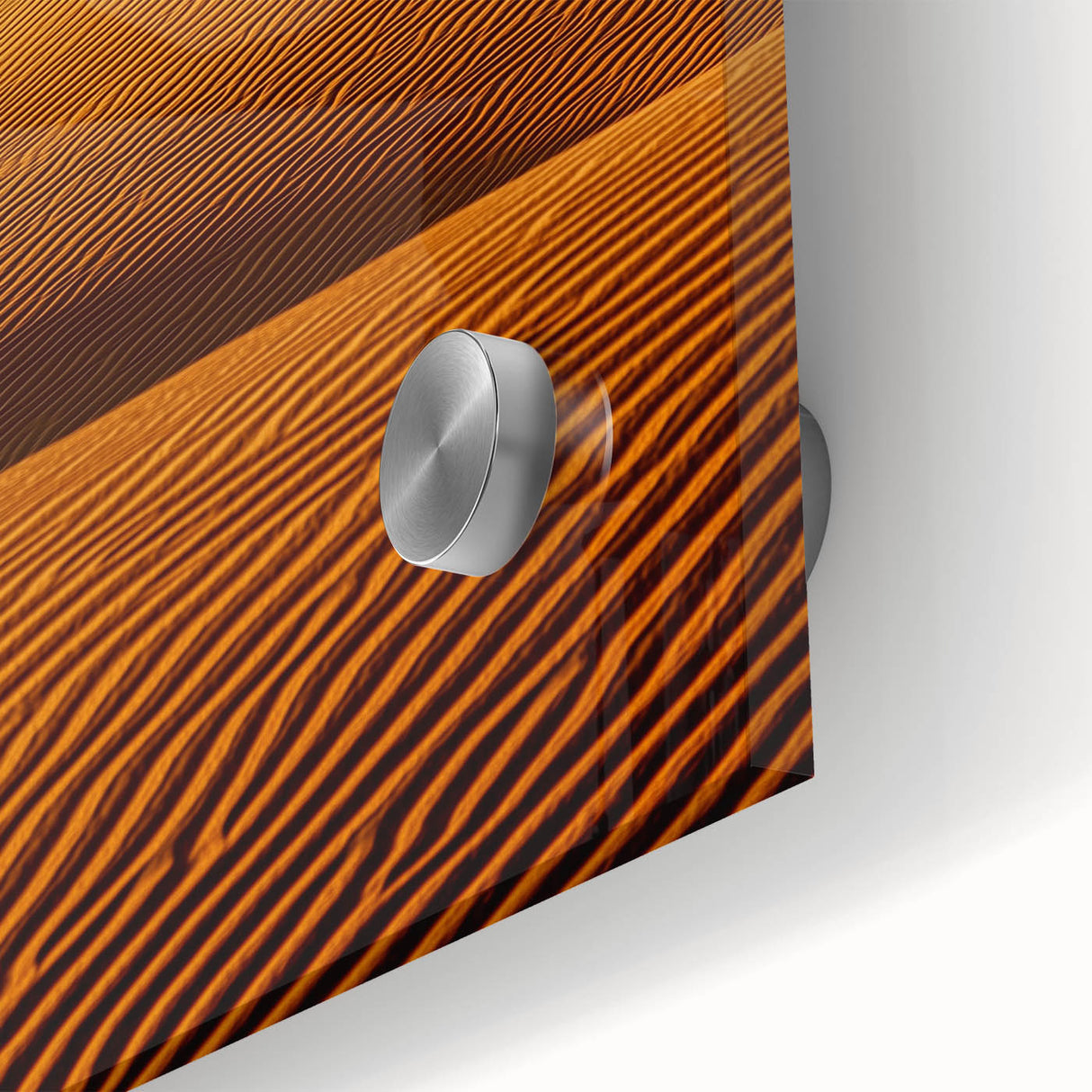 Close-up of a textured acrylic glass artwork depicting vibrant desert dunes, showcasing warm tones of orange and yellow, perfect for modern home decor.