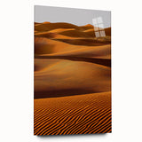 Side view of a sleek acrylic glass print showcasing a serene desert landscape with rolling dunes, featuring soft beige and golden hues, ideal for enhancing modern home decor.