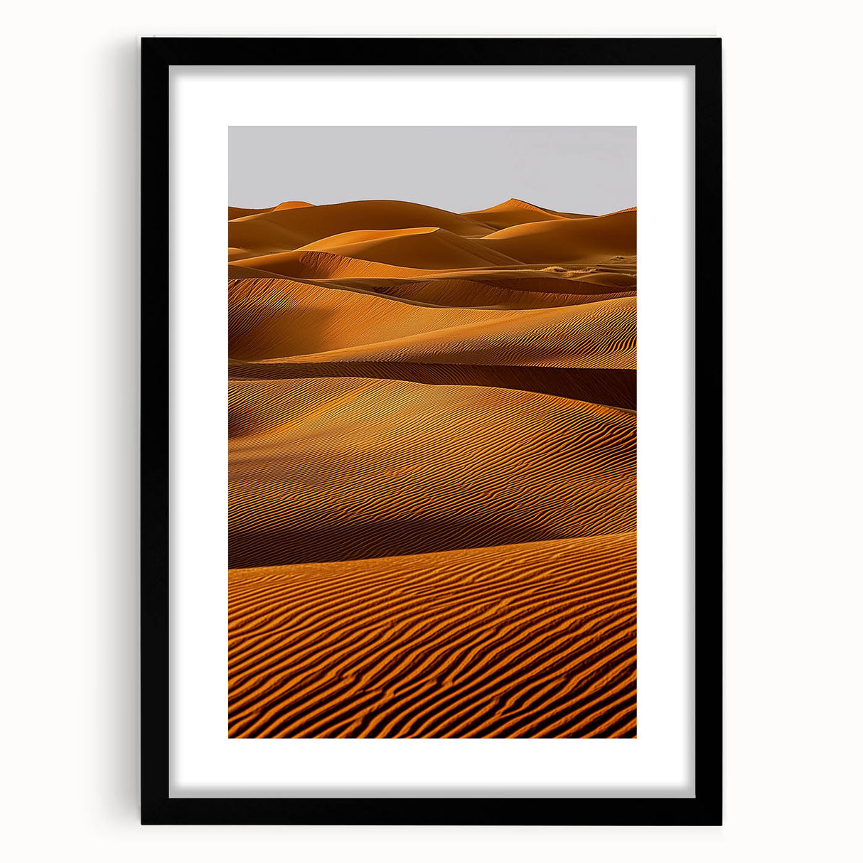 Framed landscape artwork showcasing serene sand dunes in neutral tones, presented with a black mat, ideal for modern home decor or office aesthetics.