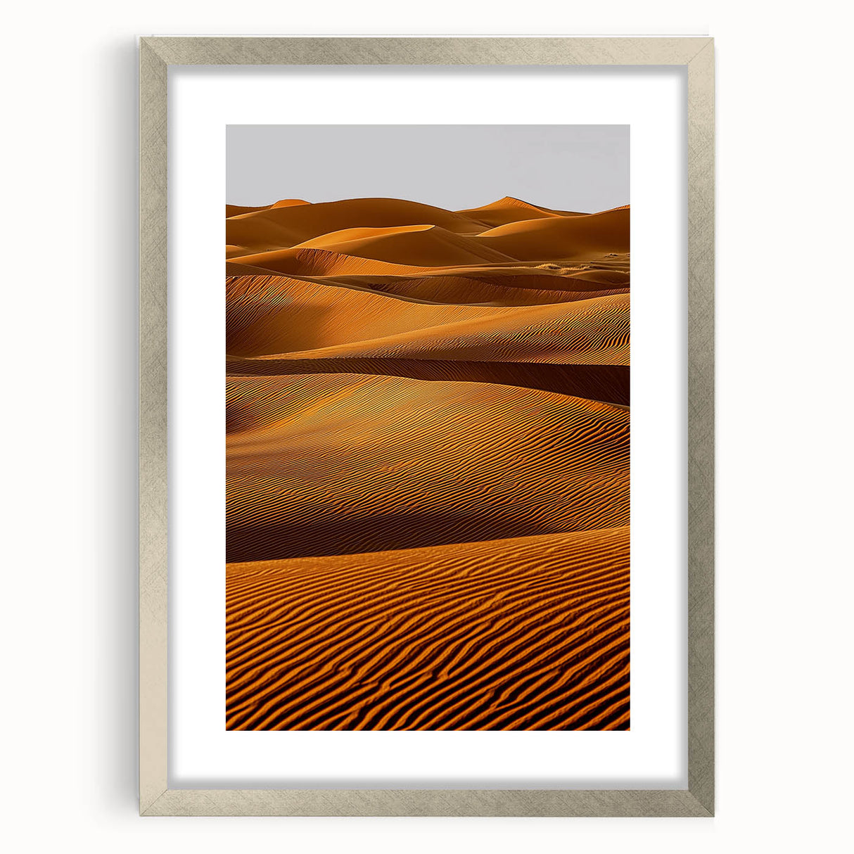 Framed landscape artwork depicting serene sand dunes, presented in a silver mat and frame, ideal for modern home decor. Perfect for nature lovers seeking to enhance their living space.