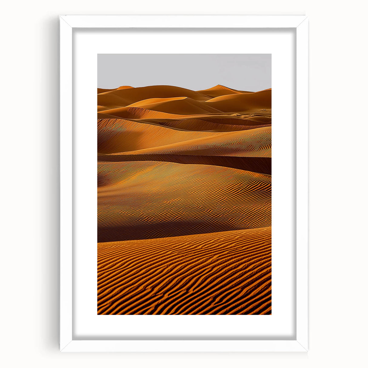 Framed landscape artwork depicting serene sand dunes under a blue sky, featuring a white mat and sleek black frame, perfect for home decor or office aesthetics.