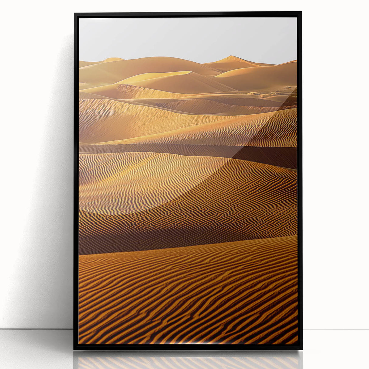 Framed acrylic wall art showcasing a stunning desert dune landscape in black frame, perfect for modern home decor, adding warmth and elegance to any space.