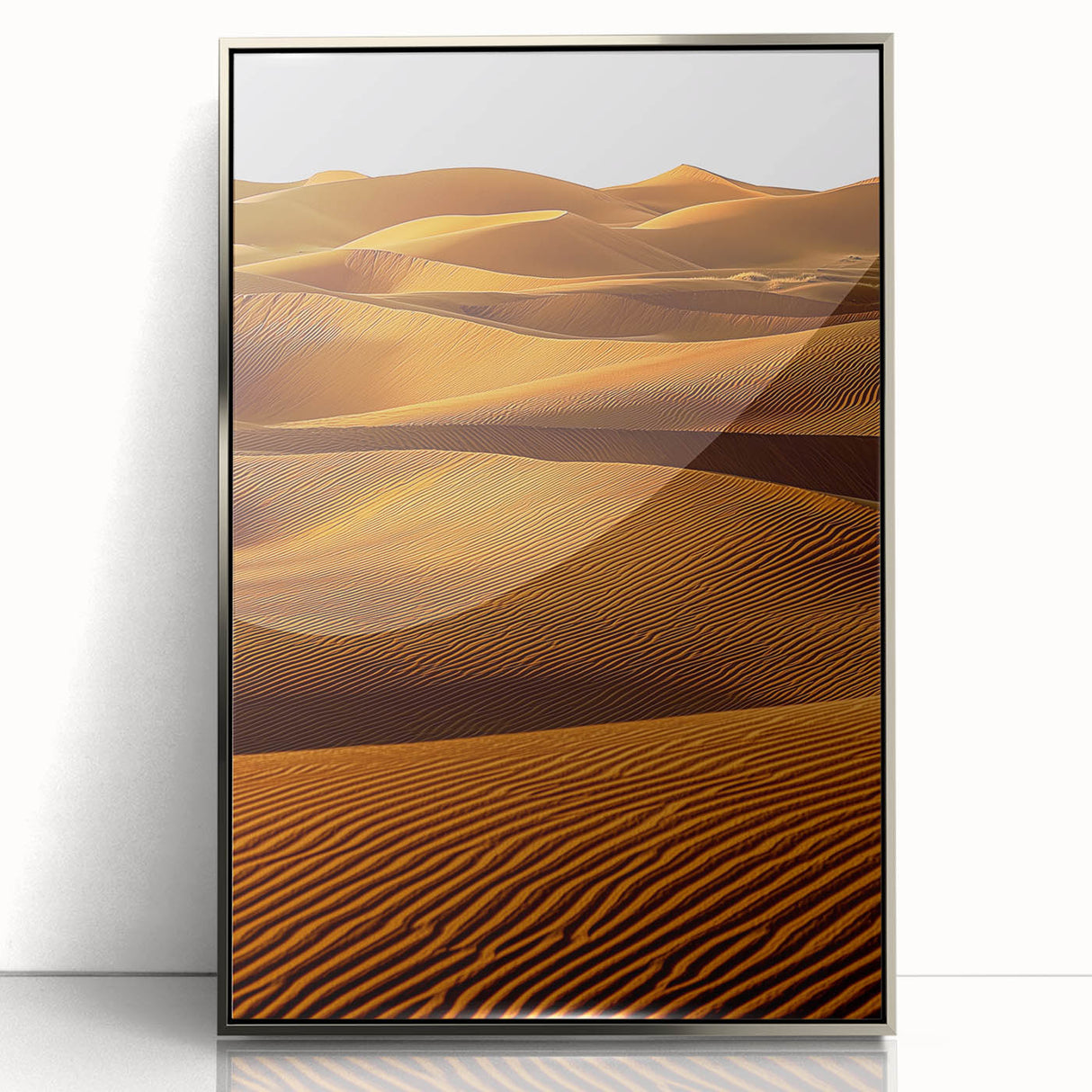 Framed acrylic artwork showcasing a serene landscape of rolling sand dunes, highlighted with silver accents, perfect for modern home decor.
