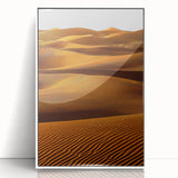 Framed acrylic artwork depicting serene dunes landscape in soft beige and blue tones, displayed in a sleek white frame for modern home decor.