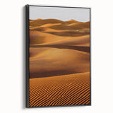 Framed canvas artwork showcasing a serene desert landscape with rolling dunes, presented in a sleek black frame, ideal for modern home decor. Perfect for enhancing interior aesthetics with a touch of nature's beauty.