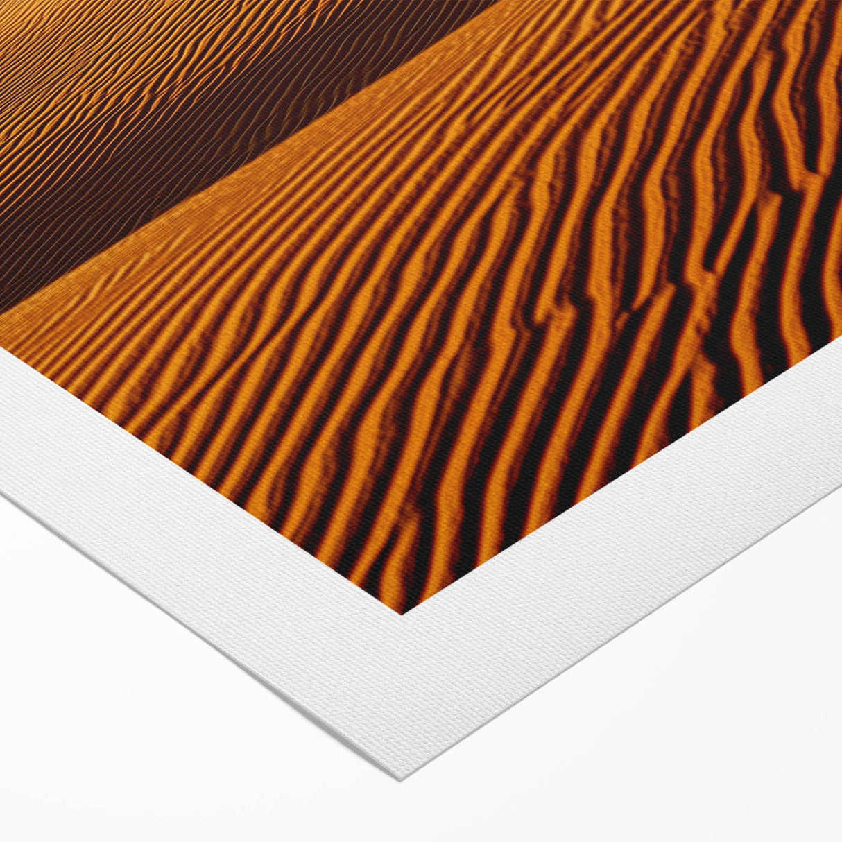 Rolled canvas print showcasing a picturesque desert landscape with vibrant dunes and warm hues, elegantly packaged in a protective cardboard tube for easy transport.
