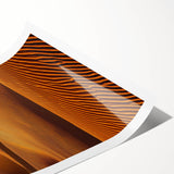 Dune landscape rolled print showcasing soft beige and golden sands under a bright blue sky, elegantly packaged in a protective cardboard tube for shipping.