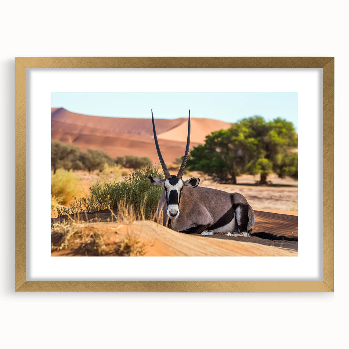 Textured art print of a Namibian landscape in muted earth tones, framed in gold, suitable for bedroom decor.