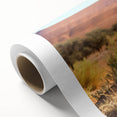 Art deco poster of a Namibian landscape on rolled canvas, featuring soft earth tones.