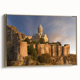 Framed canvas wall art featuring a vintage-style landscape painting of a Georgian scene in black and gold tones.