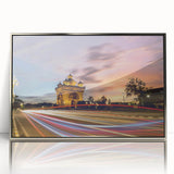 Mid-century modernist art depicting a serene Laotian landscape in soft green and blue tones, framed in silver acrylic.
