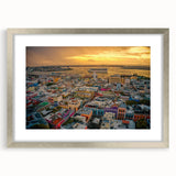 Extra large abstract art print of a Caribbean scenery in muted blue and green tones, framed with a silver mat.