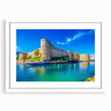 Textured art featuring abstract scenery of Cyprus in muted earth tones on a framed white mat, suitable for bedroom decor.