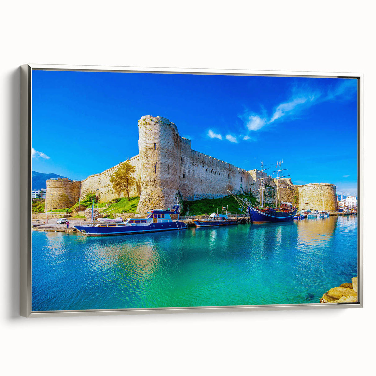Framed canvas of a vintage European landscape painting, featuring muted earth tones, ideal for living room decor.