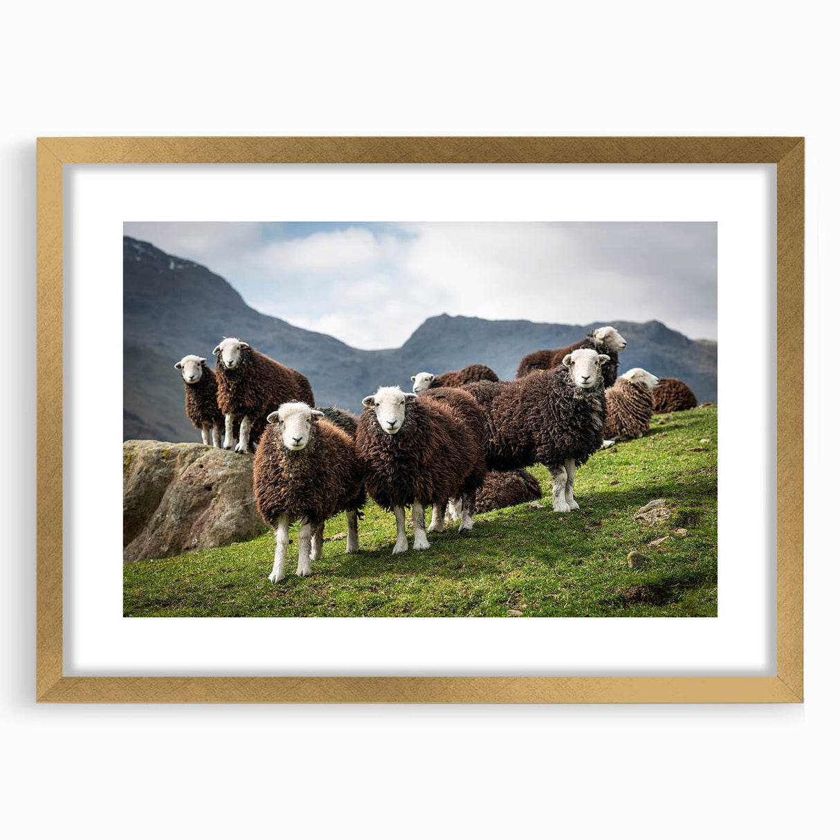 Abstract art print of Cumbria, England, with muted earth tones on a gold-framed canvas, suitable for dining room decor.