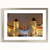 Extra large abstract art print of a European cityscape in muted gray and blue tones, framed in silver.