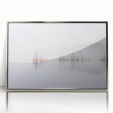 Large art print of a serene Finnish landscape in muted blue and green tones, framed in silver acrylic.