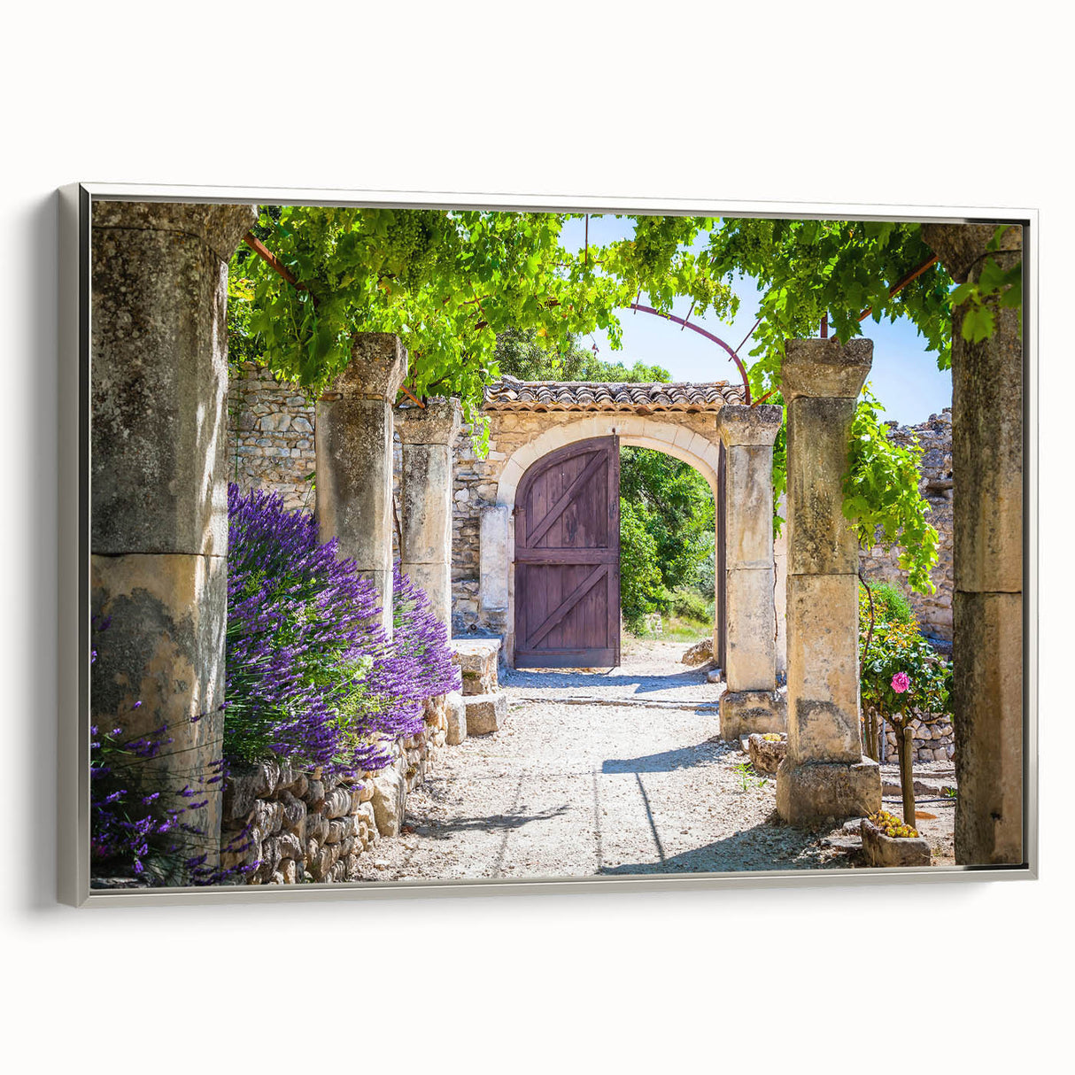 Landscape painting of Provence with muted earth tones on a silver-framed canvas, ideal for bedroom wall art.