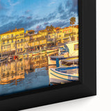 Black wall art depicting a textured, colorful European village scene on extra large framed canvas.