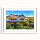 Textured abstract art print depicting a serene Icelandic landscape in muted blue and grey tones, framed with a white mat.