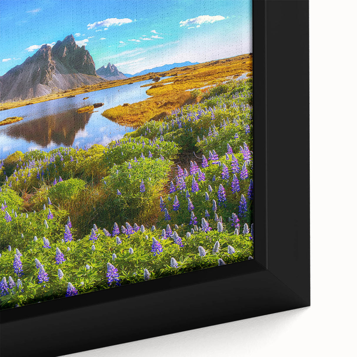Extra large framed canvas featuring a textured depiction of a black rocky Icelandic landscape with colorful sky.