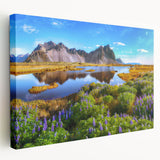 Large art print of an Icelandic landscape on stretched canvas, featuring muted green and blue tones.