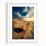 Textured art print of an abstract European landscape in muted earth tones on a framed white mat, suitable for bedroom decor.