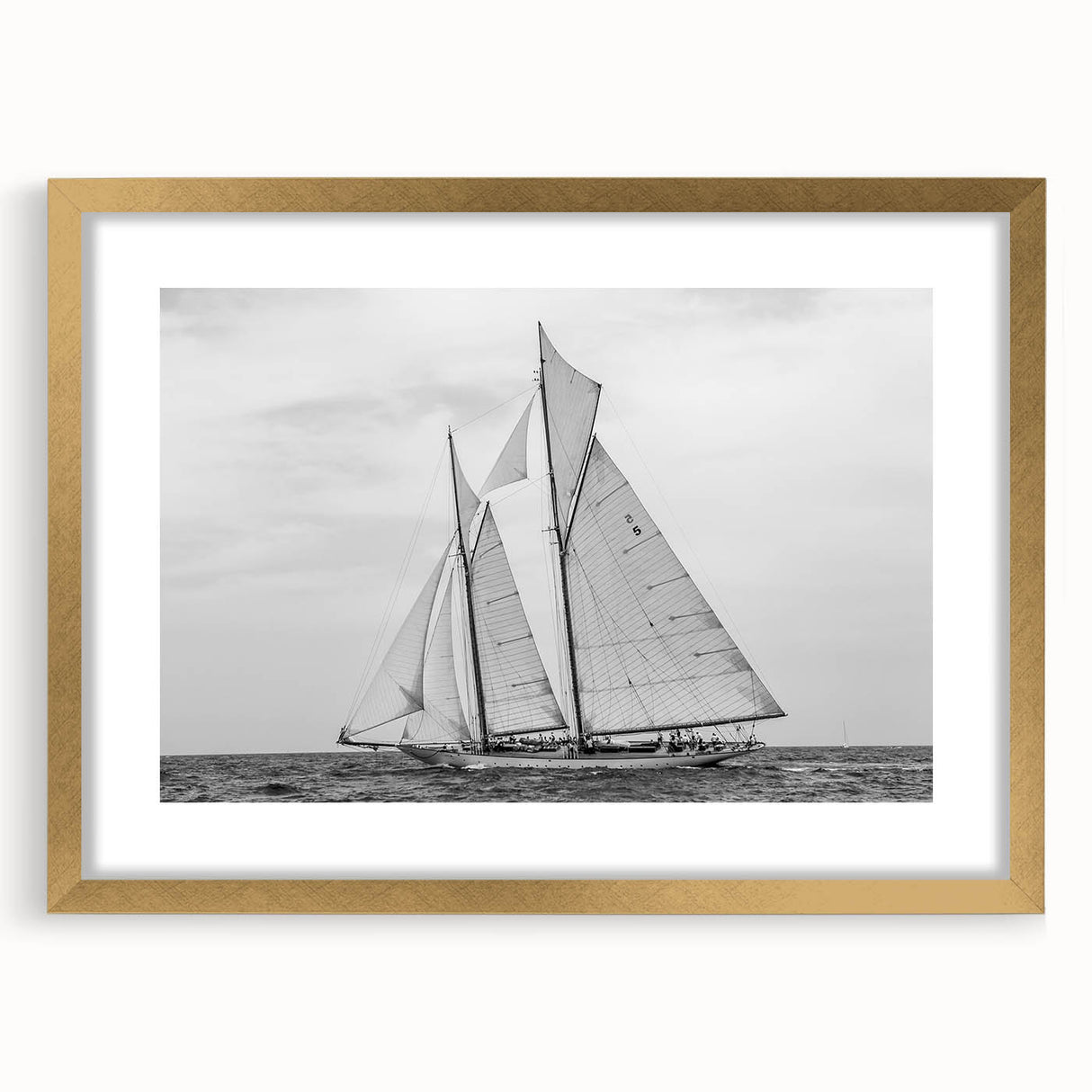 Abstract art print of Barcelona scenery in muted gold and blue tones, framed with a gold mat, suitable for dining room decor.