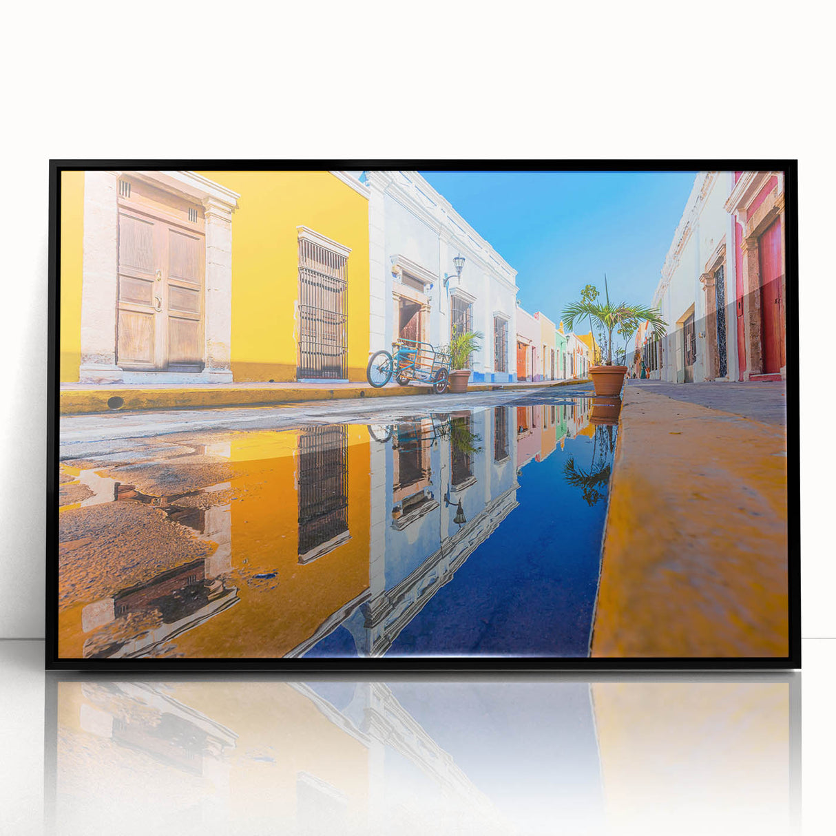 Large abstract wall art depicting Yucatan scenery in muted earth tones, framed in black acrylic.